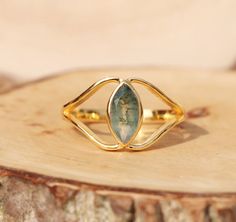 Awesome Moss Agate Ring, 925 Sterling Silver Ring, 18k Gold Plated,  Faceted Dainty Gemstone Ring, Size-8x12 Mm, Trendy Jewelry, gift for her This Sterling Silver Gemstone Ring is perfect as a gift item, for you and especially your loved ones. We Also Accept Wholesale Or Orders And All Kinds Jewelry & Gemstones Re Available In Small And Bulk Quantity. For Any Query Please Contact Us. * All our jewelry is Micron Plated which is higher quality as compared to Standard Plating * Please note that there will be slight variations in stone texture and color shades in the actual product that you receive. Stone quality or grade will be same. Product Info  Gemstone -- Moss Agate Size -- 8x12 MM. Metal -- 925 Sterling Silver Stone Color - Green & Clean Band Colour - As Your Wish SHIPPING POLICY .After Moosachat Ring, Marquise Cut Rings, Green Moss Agate, Ring Marquise, Moss Agate Ring, Vermeil Jewelry, Agate Ring, Multi Stone Ring, Trendy Jewelry