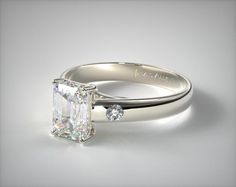 an engagement ring with a princess cut diamond