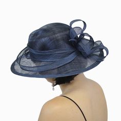 Designed by Complit Hats of Italy, the Belfry Lia creates instant interest with its asymmetrical brim and millinery crown. Made of lightweight sinamay, the Lia is dyed a soft, rich blue and adorned with a hand-pleated sinamay hat band and bow. Two sinamay ribbons circle the crown for a touch of graceful artistry. FEATURESStyle: Medium Brim Dress HatMaterial: SinamayDimensions: 3" Crown, 3 3/4" Brim at Widest PointFit: One Size, 58cm *Due to the size of this product standard shipping rates do not Chic Blue Adjustable Hat, Handmade Blue Brimmed Hat, Artisan Blue Adjustable Hat, Luxury Blue Elegant Hat, Whimsical Blue Wide-brim Hat, Pork Pie Hat, Hat Size Chart, Sinamay Hats, Pork Pie