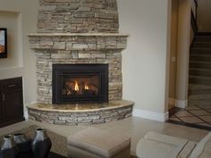 a stone fireplace in a living room