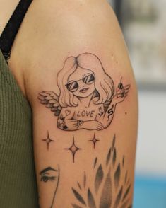 a woman with a tattoo on her arm