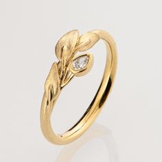 "A handmade 14k gold leaves ring set with a small pear-shaped diamond. Diamond - Weight - 0.05ct Color - E-F Clarity - VS If you are looking at this ring then you are probably looking for something special, something different. The engagement rings I design are made of 100% recycled gold and non-conflict diamonds of high quality. I am sure you have seen a huge variety of engagement rings and I am guessing you get the feeling that they all look pretty much the same... maybe you even had the notio Leaves Ring, Gold Leaf Rings, Gold Leaves, Leaf Ring, Pear Shaped Diamond, I Design, Recycled Gold, Something Special, Pear Shaped