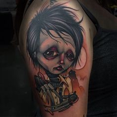 a woman with a creepy face and hair on her arm is shown in this tattoo