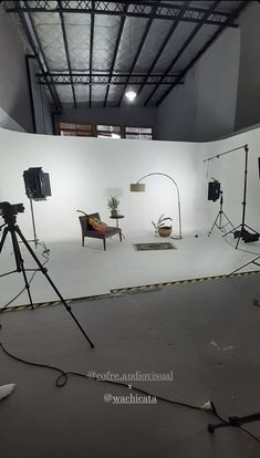 an empty photo studio with lighting equipment