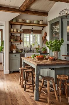 a kitchen with wooden floors and green cabinets