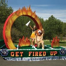 an image of two people in costume on a float that says get fired with fire