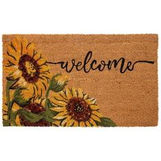 a welcome mat with sunflowers on it