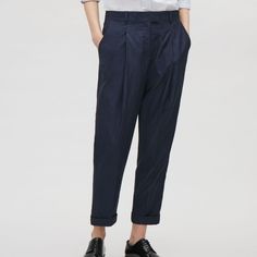 A Design We Love, These Softly Tailored Trousers Are A Relaxed Fit With Casual Turn-Up Cuffs. - Straight Fit - Hook And Bar Closure - Two Side Pockets - Welt Pocket At The Back - Press Folds At The Front - 100% Polyester - Machine Washable Measurement: Waist - 28 Inches, Hips 34 Inches, Inseam 26 Navy Cotton Ankle-length Pants, Navy Relaxed Fit Straight Pants, Navy Relaxed Fit Pants, Navy Relaxed Fit Trousers, Navy Relaxed Fit Bottoms For Workwear, Tailored Navy Bottoms With Pockets, Navy Relaxed Fit Bottoms For Spring, Navy Relaxed Fit Pants For Spring, Spring Navy Relaxed Fit Bottoms