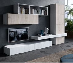 a modern living room with bookshelves and entertainment center