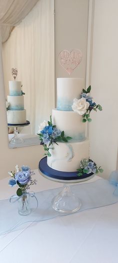 Blue, roses, poppies, hydrangea , sea thistle  all in sugar.  Marbling, watercolour tall and elegant Dusty Blue Simple Wedding Cake, Wedding Cake Designs 2 Tier Blue, 2 Tier Elegant Wedding Cake, 3 Tier Wedding Cake Dusty Blue, Wedding Cake 2 Tier Blue, White Blue Wedding Cake, Watercolour Wedding Cake, Simple 3 Tier Cake Designs, 2 Tiered Cake Ideas