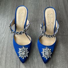 Rich Blue Satin Heels From Jessica Simpson Collection Accented With Jewels. Pointed Toe, Slide On Mule Style. Only Tried On Indoors, Never Worn Out. Excellent Condition. One Small Scuff To The Satin (Pictured). Barely Noticeable But Noted For Full Disclosure. Size 7.5/38 Glamorous Blue High Heel Wedding Shoes, Blue Glamorous Wedding Shoes For Party, Blue Wedding Shoes With 4-inch Heel, Blue Heels With Rhinestones And Round Toe, Blue Pointed Toe Heels With Rhinestones, Blue Rhinestone Pointed Toe Heels, Blue Pointed Toe Wedding Shoes For Party, Royal Blue Pointed Toe Heels For Evening, Blue Satin Heels