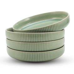 three green dishes stacked on top of each other