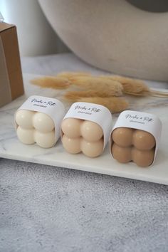 three eggs sitting on top of a white counter