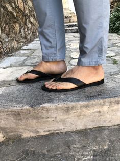 A handmade pair of flip flop sandals for men with a knot in black color, that is made from genuine leather in Greece. In Christina Christi Jewels store you can see more than 10 designs in Men's Leather Sandals. You can have them in 2-4 Days with DHL EXPRESS SHIPPING The sole is lightweight and handmade with of high-durability rubber. You can enjoy miles of safety walk and sandal's soles will be always on shape. Each pair of this leather sandals is unique. Sometimes has some small natural marks o Leather Toe Post Flip Flops For Vacation, Leather Slip-on T-strap Sandals For Beach, Leather Toe Post Slippers For The Beach, Black Leather Footbed Slippers For The Beach, Leather Flip Flops With Rubber Sole For Vacation, Black T-strap Sandals With Rubber Sole For Beach, Vacation Leather Flip Flops With Rubber Sole, Leather T-strap Sandals With Rubber Sole For Beach, Black Leather Footbed Flip Flops For Beach