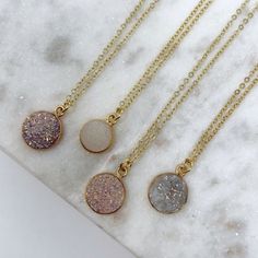 Neutral Round Druzy Necklaces Natural Color Treated Druzy Agate Circle Pendants In Neutral Shades 18k Gold Plated 18" Chains Finished With Simple Sanctuary's 18k Gold Plated Logos Handmade In Texas Each Necklace Is Sold Individually Please Refer To The First Picture To Select Necklace 1,2,3,4 Gold Round Dainty Crystal Necklace, Gold Necklace With Natural Stones, Gold Necklace With Natural Stones In Round Shape, Gold Gemstone Crystal Necklace, Dainty Gold Crystal Necklace, Gold Round Gemstone Crystal Necklace, Gold Dainty Round Crystal Necklace, Dainty Gold Round Crystal Necklace, Gold Crystal Necklace With Natural Stones In Round Pendant