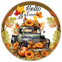 an old truck with pumpkins and sunflowers on the hood is surrounded by leaves