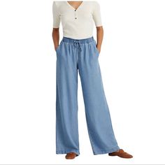 Lauren Ralph Lauren Indigo Wide-Leg Pant Color: Fair Winds Wash Size 2 Style # 575749 A Billowing Wide Leg Silhouette And A Soft, Lightweight Fabrication Create The Breezy Appeal Of These Pants, Which Are Indigo Dyed And Finished With Signature Lauren Details. Super Soft And Comfortable. -Wide Leg Intended To Hit At Ankle -Elasticized Draw Cord Waist -Two Front Waist Angle Pockets -Two Back Patch Pockets -Lyocell "Rl" Embroidered Monogram At Right Back Pocket "Lrl" Engraved Metal Cord Ends -Mach Luxury Ralph Lauren Spring Bottoms, Light Wash Wide Leg Pull-on Bottoms, Light Wash Wide-leg Workwear Pants, Wide Leg Denim Loungewear Pants, Wide Leg Denim Pants For Loungewear, Spring Wide Leg Loungewear Jeans, Wide Leg Jeans For Spring Loungewear, Wide Leg Jeans For Loungewear In Summer, Wide Leg Jeans For Summer Loungewear