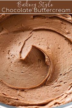 a close up of a cake pan with chocolate buttercream frosting in it