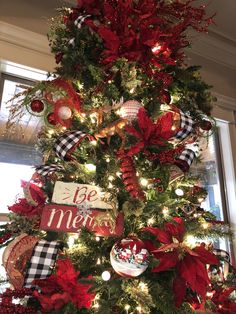 a christmas tree decorated with red, black and white ornaments