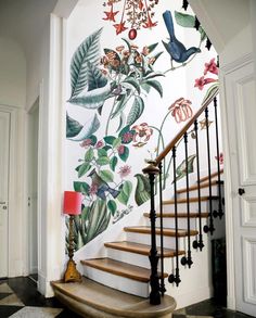 an image of a staircase decorated with flowers and birds on the wall next to it