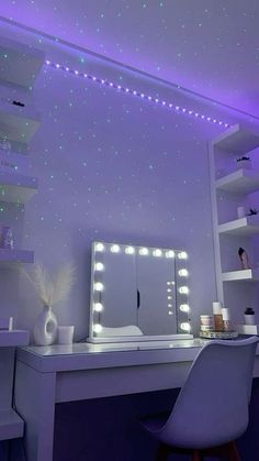 a white desk topped with a mirror and lots of lights on it's walls