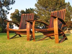 two wooden chairs sitting on top of a grass covered field next to each other with the words, 100th chair giveaway