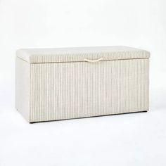 an upholstered storage box is shown on a white background