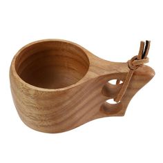 a wooden cup with a key on it