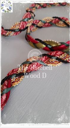 three braided bracelets with different colors and designs