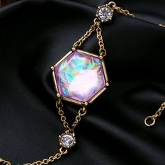 Purple/Pink Iridescent Bracelet Alloy Gold Tone Chain Crystal Resin Gold Bohemian Crystal Bracelet For Festivals, Bohemian Gold Crystal Bracelet For Festivals, Magical Gold Jewelry For Party, Spiritual Purple Jewelry For Parties, Purple Party Jewelry With Adjustable Chain, Bohemian Purple Crystal Bracelet For Party, Purple Spiritual Jewelry For Party, Rainbow Bohemian Bracelets For Party, Bohemian Purple Bracelet For Party