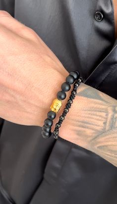 This Golden Buddha bracelet set is an adjustable beaded bracelet that shines with spiritual and cultural meaning. This "Awakened One" eight inch bracelet set is perfect for men and women's everyday wear to add some fresh detail to your wrist. (2 pc set) Great Holiday Gift Material: 18K Gold Plated on Stainless Steel. Tarnish and water resistant. ﻿ALL SALE ITEMS ARE FINAL SALE Adjustable Symbolic Gold Beaded Bracelets, Spiritual Friendship Bracelets With Round Beads, Resizable Spiritual Friendship Bracelets With Beads, Spiritual Resizable Friendship Bracelets With Round Beads, Adjustable Rosary Bracelet For Healing With 108 Beads, Adjustable Gold Hand Wrapped Rosary Bracelet, Spiritual Hand-strung Bracelets For Friendship, Casual Hand-strung Bracelets For Meditation, Spiritual Black Rosary Bracelet For Friendship