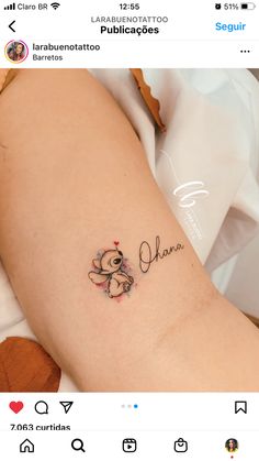 a tattoo with the word love written on it and a teddy bear holding a heart