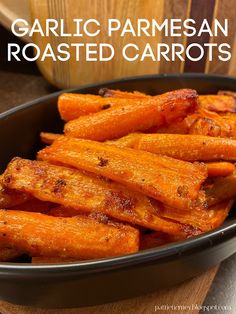 garlic parmesan roasted carrots in a black bowl