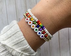 Adjustable Rainbow Friendship Bracelets With Letter Beads, Everyday Adjustable Rainbow Beaded Bracelets, Adjustable Rainbow Beaded Bracelets For Everyday, Adjustable Rainbow Jewelry For Everyday, Adjustable Rainbow Heart Beads Jewelry, Trendy Jewelry For Pride Gifts, Multicolor Bracelets For Pride, Multicolor Pride Bracelets As A Gift, Multicolor Bracelets For Pride Gift