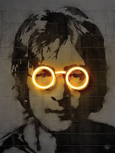 a wall with a painting of a man wearing glasses and the words harry potter painted on it