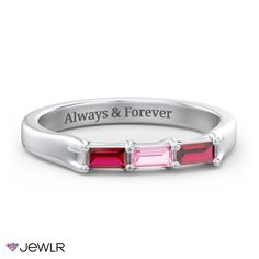 a white gold band with three stones and the words always & forever engraved on it