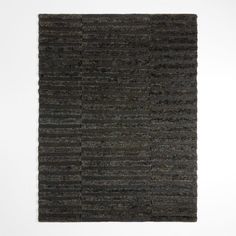 an area rug with black and grey stripes