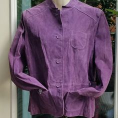 St John's Bay Suede Leather Jacket In A Rosey Lavendar/Purple Long Sleeve Jacket W/Cuffs. Front Tabs 4" W/2 Patch Pockets 4.5" X 4.5". Back Has A Sewn In Belt For The Princess Fit. Completely Lined W/ Inside Buttons Reinforced 4 Outside Buttons (Makes Them Even Stronger) W/Bound Button Holes. Front & Back Yoked. Some Buttons Have The Paper Protectors On Them. Needs To Be Steamed Or Professionally Done Shell 100% Leather Lining 100% Polyester Machine Washable. Non Smoking And Pet Friendly Home Spring Purple Outerwear For Work, Classic Purple Outerwear With Pockets, Purple Button-up Outerwear With Pockets, Casual Purple Outerwear For Work, Classic Purple Outerwear For Spring, Purple Cotton Outerwear With Pockets, Classic Purple Spring Outerwear, Classic Purple Blazer For Spring, Spring Purple Blazer With Pockets