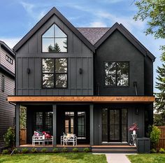 a large gray house with lots of windows