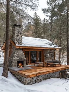 a log cabin in the woods with snow on the ground