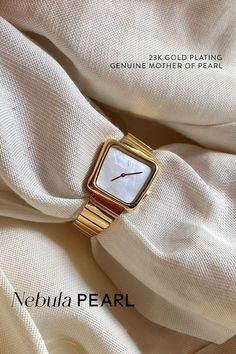 The Nebula Pearl embodies a classic aesthetic and modernism. Easily elevate your date-night look or transform your loungewear to casual chic. The genuine white Mother of Pearl dial pairs beautifully with the 23-karatt gold mesh bracelet, the perfect gift for yourself or a loved one. Elegant Yellow Gold Watch For Everyday Wear, Elegant Yellow Gold Watch For Everyday, Elegant Yellow Gold Everyday Watch, Elegant Everyday Yellow Gold Watch, Classic White Watches With Bracelet Strap, Mother Of Pearl Watch, Classic White Jewelry And Watch With Round Dial, Gold Minimalist Watch With Bracelet Strap, Minimalist Gold Watch With Bracelet Strap