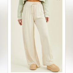 Live In Linen With These Soft And Flowy Linen Blend Pants, Perfect For Throwing On Over Your Swimsuit Or Creating The Perfect Casual Look. Fit: Relaxed Closure: Slip On, Tie Waist Material: 80% Rayon, 20% Linen Cream Drawstring Pants For Loungewear, Beige Drawstring Bottoms For Loungewear, Casual Cream Bottoms With Drawstring, Cream Drawstring Bottoms For Loungewear, Beige Wide Leg Leisure Pants, Beige Drawstring Pants For Loungewear, Casual Cream Wide Leg Pants With Elastic Waistband, Casual Cream Bottoms For Loungewear, Casual Cream Loungewear Pants