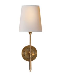 a wall light with a white shade on the top and bottom part of it's arm