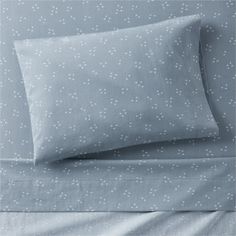 the sheets and pillowcases are made in blue with white polka dots on them