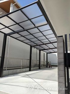 an outdoor covered area with metal bars and windows