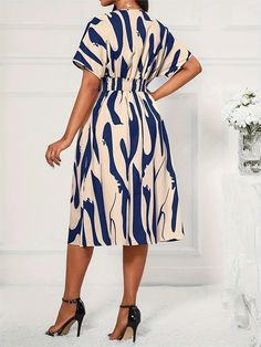 SPECIFICATIONS Material: Polyester Elasticity: Slight Strech Season: Summer Pattern Type: Print Fit Type: Slim Gender: WOMEN Dresses Length: Mid-Calf Sleeve Style: Batwing Sleeve Waistline: Natural Silhouette: Fit and Flare Neckline: V-Neck Sleeve Length(cm): short