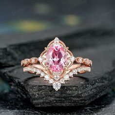 Engagement Ring Set ★Description Main ring: *Center stone: 1.6 carat Lab Grown Pink Sapphire *Size: 6x8mm Oval Shaped *Accent stone: Moissanite *Band Width: 1.7mm Weight: 0.15Ct Wedding band: *Accent stone: Moissanite Weight: 0.2Ct Band width: 1.5mm ❤️ Engravings We offer engravings service with an extra $2, please provide the engravings text within 16 letters without any signs. ❤️Procedure information Please select the style, the metal  material and ring size from the drop-down list on the righ Pink Sapphire Engagement Ring With Wedding Band, Oval Moissanite Diamond Ring For Marriage, Oval Prong Setting Bridal Sets As Gift, Diamond White Oval Topaz Wedding Ring, Oval Diamond Ring With Rose Cut Diamonds For Marriage, Oval Diamond White Topaz Ring For Wedding, Oval Diamond White Topaz Wedding Ring, Oval Bridal Sets With Prong Setting As Gift, Rose Gold Sapphire Ring With Diamond, Oval Cut