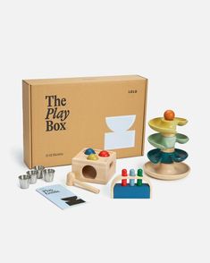 the play box includes toys such as cups and saucers