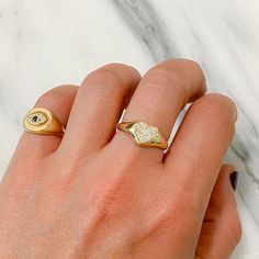 This signet style ring is composed of 14K solid gold & pavé set with GVs1 quality natural real Diamonds covering the entire heart's surface. Ring Dimensions: Surface: approximately 8mm (w) x 8mm (h) Surface Height from Inner Band Thickness: approximately 3.5mm Inner Band Ring Thickness: approximately 2mm Metal Finish: High Shine Polish This design is available in Rose, White and Yellow 14K Gold This item is proudly made in USA and also available in 18K solid gold options upon request. Kindly Luxury Stackable Signet Ring For Gift, Luxury Personalized Signet Promise Ring, Luxury Stackable Signet Ring For Promise, Personalized Diamond Signet Ring Gift, Luxury Single Diamond Signet Ring Gift, Heart Signet Ring, Word Ring, Affordable Gifts, Diamond Heart