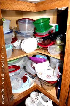 an open cabinet filled with lots of dishes